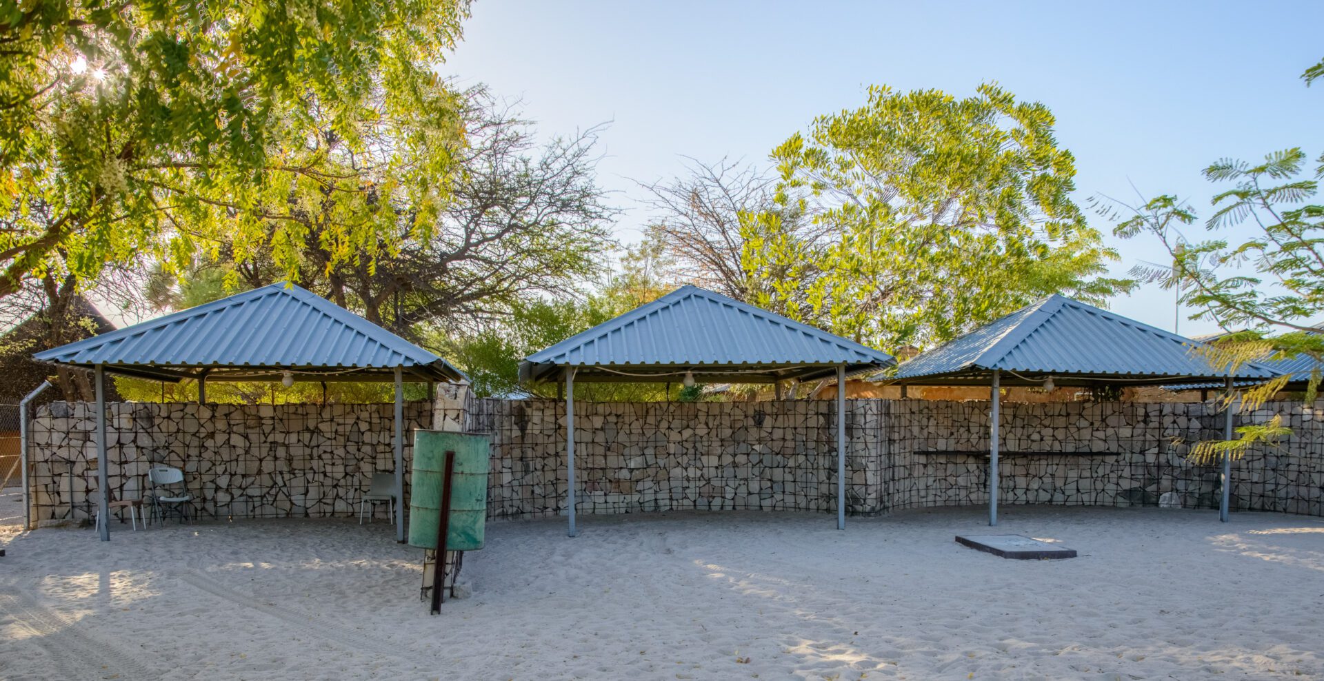 a sand pit with a wooden bench