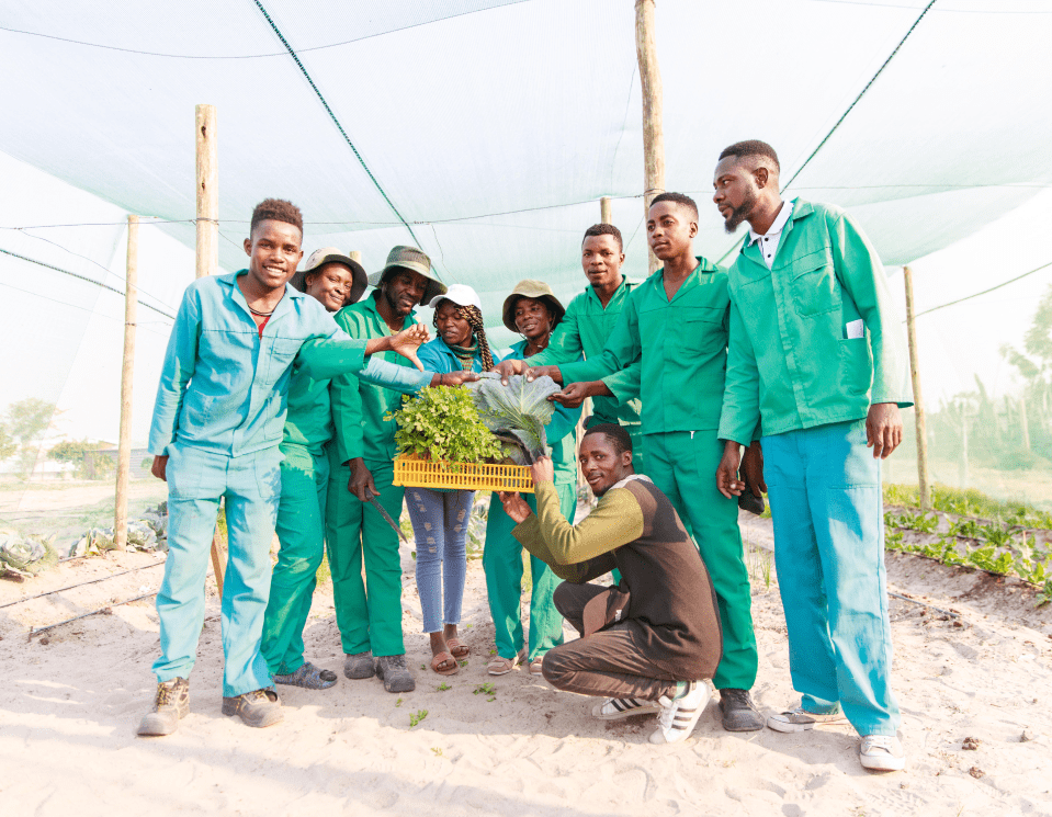 a group of people in green uniforms standing in a field